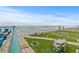 Relaxing exterior view with ocean view and outdoor seating area on manicured lawn at 3311 S Atlantic Ave # 1704, Daytona Beach Shores, FL 32118