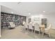 Well-stocked library with ample seating, creating a peaceful retreat for reading and relaxation at 3311 S Atlantic Ave # 1704, Daytona Beach Shores, FL 32118