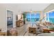Inviting living room with ocean views, comfortable seating, a decorative rug, and tasteful decor at 3311 S Atlantic Ave # 1704, Daytona Beach Shores, FL 32118