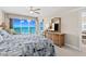 Inviting bedroom boasts serene ocean views, a ceiling fan, and a TV for ultimate relaxation at 3311 S Atlantic Ave # 1704, Daytona Beach Shores, FL 32118