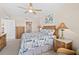 Comfortable main bedroom featuring wooden furniture, neutral walls, and an ensuite bathroom at 3311 S Atlantic Ave # 1704, Daytona Beach Shores, FL 32118