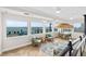 Inviting sitting area featuring comfortable seating and stunning ocean views through expansive windows at 3311 S Atlantic Ave # 1704, Daytona Beach Shores, FL 32118