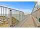Inviting walkway with railing, providing scenic ocean views and easy beach access at 3311 S Atlantic Ave # 1704, Daytona Beach Shores, FL 32118