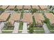 A high-angle view showcases a neighborhood with well-maintained homes and green lawns at 3451 Luna Bella Ln, New Smyrna Beach, FL 32168