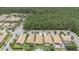 An aerial view of a residential neighborhood showing the tile roofs and landscaping at 3451 Luna Bella Ln, New Smyrna Beach, FL 32168