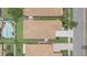 Aerial view of a well-maintained house with a tidy yard and neighboring properties nearby at 3451 Luna Bella Ln, New Smyrna Beach, FL 32168