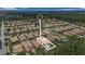 An aerial view of a residential area with many single Gathering homes and lush green trees at 3451 Luna Bella Ln, New Smyrna Beach, FL 32168