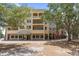 Lovely building exterior featuring multiple levels, balconies, awning, and lots of large windows at 3451 Luna Bella Ln, New Smyrna Beach, FL 32168