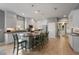Well-lit kitchen featuring granite counters, a central island, and stainless steel appliances at 3451 Luna Bella Ln, New Smyrna Beach, FL 32168