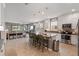 Bright kitchen with an island, stainless appliances, a tile backsplash and pendant lighting at 3451 Luna Bella Ln, New Smyrna Beach, FL 32168