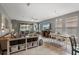 Open concept living and dining area with large windows and neutral colors at 3451 Luna Bella Ln, New Smyrna Beach, FL 32168