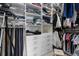 Organized walk-in closet with custom shelving and storage drawers for optimal wardrobe management at 3451 Luna Bella Ln, New Smyrna Beach, FL 32168