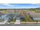 Aerial view showcasing the house and scenic pond views within the community at 34568 Shellback St, Leesburg, FL 34788