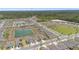 Beautiful aerial view of a planned community with ponds, green space, and modern single-Gathering homes at 34568 Shellback St, Leesburg, FL 34788