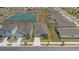 An aerial view showing the home, the lake, and community street layouts at 34568 Shellback St, Leesburg, FL 34788