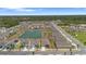 Expansive aerial view of the residential area with lakes, playgrounds, and greenery at 34568 Shellback St, Leesburg, FL 34788