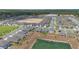 Panoramic aerial view of a well-planned neighborhood featuring community lakes and facilities at 34568 Shellback St, Leesburg, FL 34788
