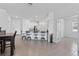 Open-concept living with kitchen island and bar seating, perfect for entertaining at 34568 Shellback St, Leesburg, FL 34788