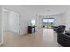 Spacious living room with sliding glass doors to the patio and views of the lake at 34568 Shellback St, Leesburg, FL 34788