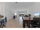 Bright and airy open-concept living space with a dining area and view of the backyard at 34568 Shellback St, Leesburg, FL 34788