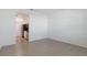 The living space features tile flooring next to the kitchenette with stainless steel appliances at 34568 Shellback St, Leesburg, FL 34788