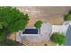Aerial view of a home featuring solar panels, surrounded by lush greenery and mature trees at 357 Heritage Estates Ln, Deland, FL 32720