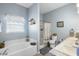 Bright bathroom with soaking tub, shower, and dual sinks at 357 Heritage Estates Ln, Deland, FL 32720