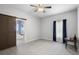 Spacious bedroom with tile floors, barn door to bathroom, and neutral walls at 357 Heritage Estates Ln, Deland, FL 32720