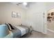 Cozy bedroom featuring neutral walls, decorative prints, and a closet for storage at 357 Heritage Estates Ln, Deland, FL 32720