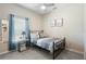 A cozy bedroom with a full-sized bed, a ceiling fan and plenty of natural light at 357 Heritage Estates Ln, Deland, FL 32720