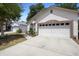 This charming single-Gathering home boasts a spacious two-car garage and a driveway with ample space at 357 Heritage Estates Ln, Deland, FL 32720