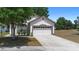 Charming single-Gathering home with a two-car garage and a well-maintained lawn at 357 Heritage Estates Ln, Deland, FL 32720