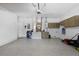 Spacious garage with epoxy flooring, built-in storage cabinets, and a designated area for tools and equipment at 357 Heritage Estates Ln, Deland, FL 32720