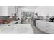 Open-concept kitchen showcasing sleek countertops, stainless steel appliances, and seamless flow into the living area at 357 Heritage Estates Ln, Deland, FL 32720