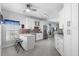 Modern kitchen featuring white cabinetry, stainless steel appliances, and a breakfast bar with seating at 357 Heritage Estates Ln, Deland, FL 32720