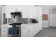 Modern kitchen showcasing stainless steel appliances, gas range, and light countertops with contemporary finishes at 357 Heritage Estates Ln, Deland, FL 32720