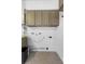 Laundry room with cabinetry, utility connections and neutral color palette at 357 Heritage Estates Ln, Deland, FL 32720