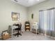 Bright home office space with tile flooring, desk, sewing machine, and window at 357 Heritage Estates Ln, Deland, FL 32720