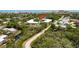 Aerial view displaying condo buildings and pool, near lush greenery and scenic coastal proximity at 3800 Saxon Dr # 150, New Smyrna Beach, FL 32169