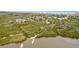 Scenic aerial view showcasing the property's proximity to the water and surrounding natural beauty at 3800 Saxon Dr # 150, New Smyrna Beach, FL 32169
