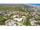 Stunning aerial view of the condo community featuring lush landscaping and a sparkling blue pool at 3800 Saxon Dr # 150, New Smyrna Beach, FL 32169