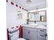 Stylish bathroom featuring a modern vanity with a vessel sink, decorative mirror and bold tile accents at 3800 Saxon Dr # 150, New Smyrna Beach, FL 32169