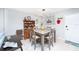 Dining area features table with seating for four, a hutch, and decor at 3800 Saxon Dr # 150, New Smyrna Beach, FL 32169