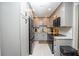 Remodeled kitchen featuring grey cabinets, granite counters, and stainless steel appliances at 3800 Saxon Dr # 150, New Smyrna Beach, FL 32169