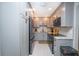 Remodeled kitchen featuring grey cabinets, granite counters, and stainless steel appliances at 3800 Saxon Dr # 150, New Smyrna Beach, FL 32169