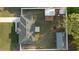 Aerial view of a home with a fenced-in yard featuring a storage shed, a covered patio, and green grass at 430 Spring Dr, Ocala, FL 34472