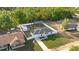 Birds eye view of home showing new roof, long driveway, and fully fenced-in yard at 430 Spring Dr, Ocala, FL 34472