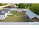 Fully fenced backyard with a shed, carport, and lush green grass at 430 Spring Dr, Ocala, FL 34472