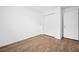 This bedroom has wood floors, a closet, and access to the hallway, a perfect space to move into at 430 Spring Dr, Ocala, FL 34472