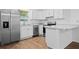 A modern kitchen featuring stainless steel appliances and quartz countertop at 430 Spring Dr, Ocala, FL 34472